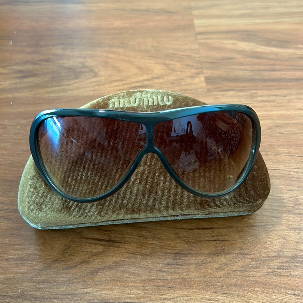 100% Authentic Miu miu sunglasses. Condition Like new